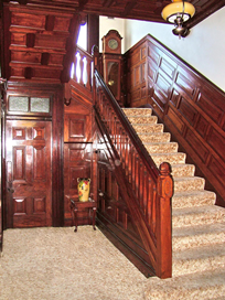 Photograph of the wooden panelled ceiling and stair at Glenarrol